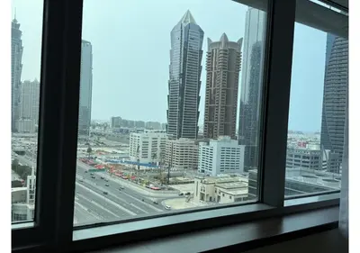 a view of a city skyline from a window at Centrally Located in Business Bay - Huge 1 Bedroom Hall in Executive Towers in Dubai