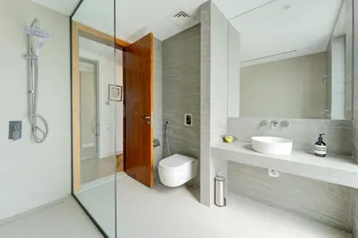 a bathroom with a toilet and a sink and a shower at Resort Villa 19 in Dubai