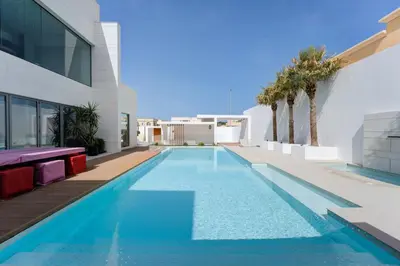 a swimming pool in the backyard of a house at Resort Villa 19 in Dubai