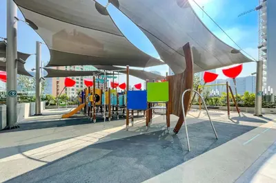 a playground with colorful chairs and a slide at CAICAI Homes Mag 318 Dubai Walking Distance to Dubai Mall in Dubai