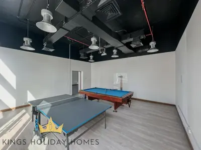 a ping pong room with a ping pong table at Central Park towers Difc Royal suite kings in Dubai