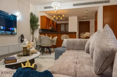 a living room with a couch and a table at Central Park towers Difc Royal suite kings in Dubai