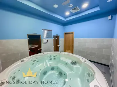 a jacuzzi tub in a bathroom with blue ceilings at Central Park towers Difc Royal suite kings in Dubai