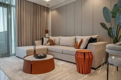 a living room with a couch and a table at Stylish 2BRUrban Retreat 10 Min to Burj Khalifa in Dubai