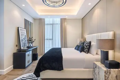 a bedroom with a large bed and a large window at Stylish 2BRUrban Retreat 10 Min to Burj Khalifa in Dubai