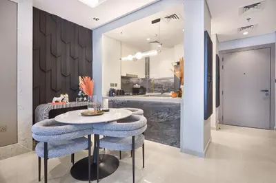 a dining room with a table and some chairs at Stylish 2BRUrban Retreat 10 Min to Burj Khalifa in Dubai