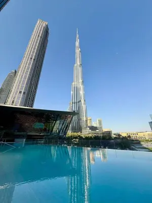 a view of a city with a tall building at 60th High Floor - full World islands, Downtown and Ocean View - high quality Design and Furniture - 2 Bedroom in Dubai