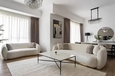 a living room with two couches and a table at 1 bedroom Apartment in JBR in Dubai
