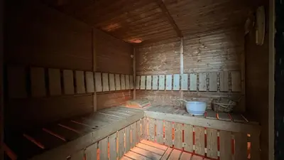 an inside of a wooden room with a tub at High floor Marina Views Walk to Beach JBR & Mall in Dubai