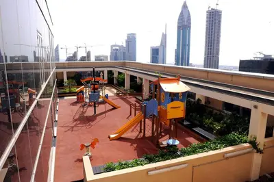 a playground on top of a building in a city at ASHRI Stylish African-Inspired Studio in DIFC in Dubai