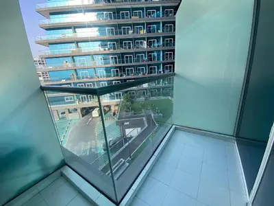 a view of a building from the glass floor of a building at Dubai Silicon Oasis Holiday Homes in Dubai