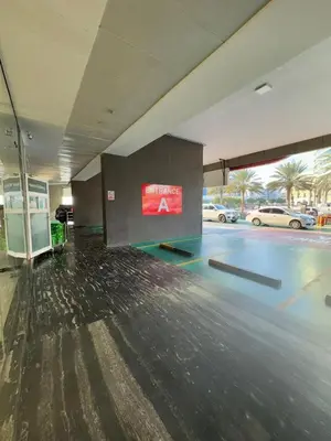 an empty parking lot with a sign in a parking garage at Dubai Silicon Oasis Holiday Homes in Dubai