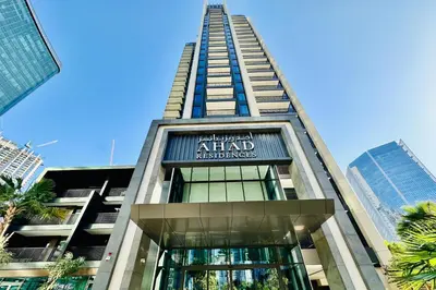 a tall building with a sign that reads atlantis residences at Vserve Modern Oasis Canal & Burj Views in Dubai