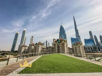 a star on the grass in front of a city at Central Park towers Difc suite kings in Dubai