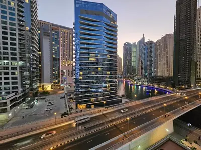a city with tall buildings and a freeway at Marina Water Residence in Dubai