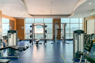 a gym with cardio equipment in a building at Frank Porter - RBC Tower in Dubai
