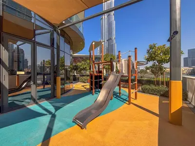 a playground in a building with a slide at Frank Porter - Grande Signature in Dubai