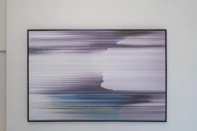 a framed painting of a man at Stunning Burj View - Cozy 2BR - 5 min Dubai Mall in Dubai