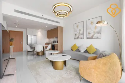 a living room with a couch and a table at Keysplease 2 BR Beach Vista, Emaar Beachfront in Dubai