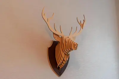 a wooden wall mounted deer head on a wall at Vacay Lettings - Stylish 1 Bedroom Apartment with Marina View, Dubai Marina in Dubai