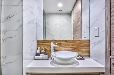 a bathroom with a sink and a mirror at Luxury Studio - SOL BAY Tower - Business Bay by Stayfinity in Dubai