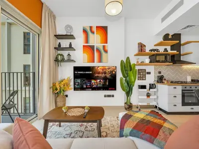 a living room with a couch and a table at Collective Chic 1BR 15mins to Downtown Dubai Mall Beaches in Dubai