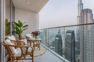 a balcony with a view of the city at High Floor Apartment with full Burj Khalifa View, Opera & Fountain - Downtown Dubai - Forte Tower by Stayfinity in Dubai