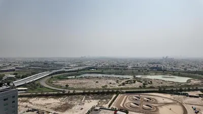 an aerial view of a city with a river at High Floor - Bright Elite Studio in Business Bay in Dubai
