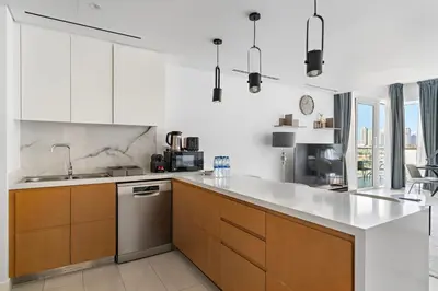 a kitchen with white cabinets and stainless steel appliances at Spacious Dubai Marina 2BR Great Views Top Location in Dubai