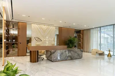 a lobby with a reception desk in a building at Brand New Cozy 2br Apartment In Jvc With Balcony in Dubai