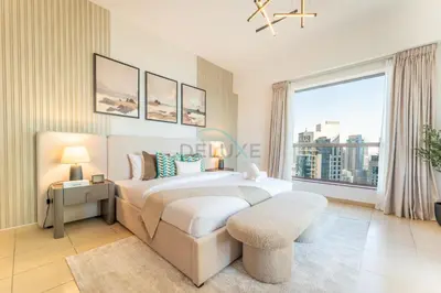 a bedroom with a bed and a large window at Close to Major Landmarks 3BR and Assistant Room with Marina Views, Rimal 5, JBR by Deluxe Holiday Homes in Dubai