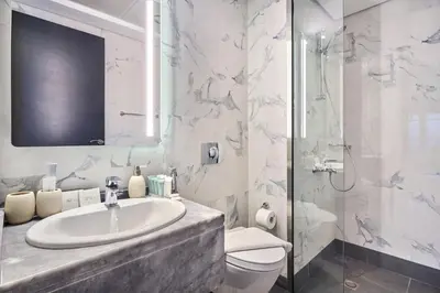 a bathroom with a sink and a toilet and a shower at Family-Friendly 2BR Apartment in Dubai South at MAG-565 near EXPO and Al Maktoum Airport DWC in Dubai