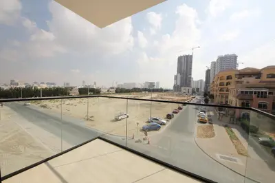 a view of a parking lot from a building at Modern 2 bedroom in Binghatti Crescent JVC- Truebleu vacation homes in Dubai