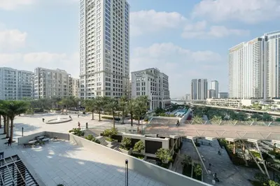 a view of a city with tall buildings at Luxury 2-Bed Retreat with Stunning Creek Views in Dubai