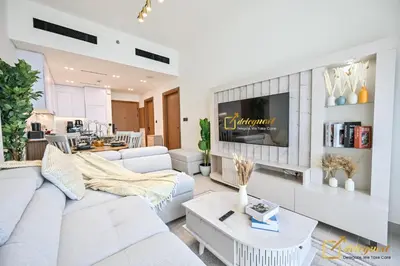 a living room with a couch and a tv at Marvelous 1BR in Binghati Amber by deleguest in Dubai