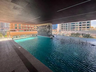 a swimming pool in the middle of a building at Frank Porter - MBL Royal in Dubai