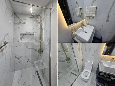 a bathroom with a shower and a sink and a toilet at Gemz by Danube - Al Furjan by Golden Casa in Dubai
