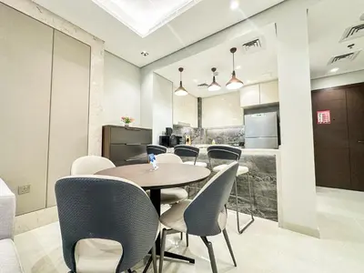 a dining room with a table and chairs at Vserve I 1 BR - Luxury Escape in Business Bay in Dubai