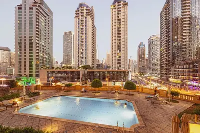 a swimming pool in a city with tall buildings at KYMA 2BDR JBR - Luxury Apartment with Full Panoramic Dubai Marina view in Dubai