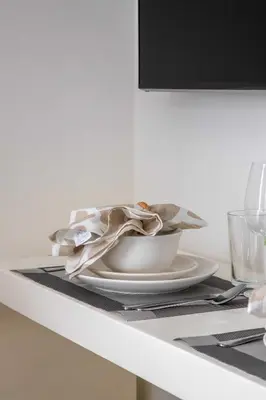 a plate on a table with a napkin on it at Frank Porter - Azizi Riviera 1 in Dubai