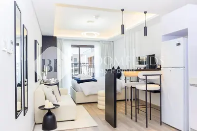 a rendering of a living room and kitchen in a apartment at Bloomfields Modern Escape STU In JVC in Dubai