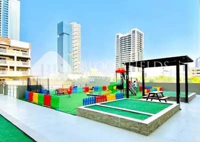 a playground on the roof of a building at Bloomfields Modern Escape STU In JVC in Dubai
