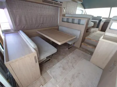 an interior view of an rv with a table and chairs at Luna Rosa in Dubai