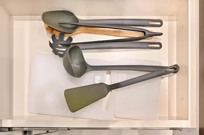 a drawer filled with different types of utensils at Stunning 1 Bdr Luxury with Burj Khalifa View in Dubai