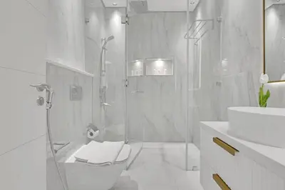 a bathroom with a shower and a toilet and a sink at Spacious 3BR , Balcony & City Views by Bhavan Vacation Homes in Dubai