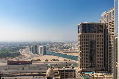 an aerial view of a city with tall buildings at Luxury 2Br Apt Stunning Views in Amna Tower by Simply Comfort in Dubai
