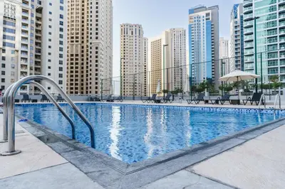 a swimming pool in a city with tall buildings at GuestReady - Fabulous home with Marina Canal views in Dubai