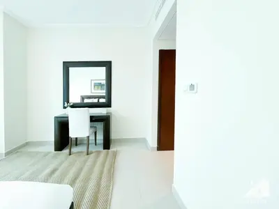 a dining room with a table and a mirror at Luxury 2B Apt with Full Marina Views - Delphine in Dubai