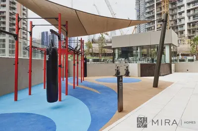 a playground in the middle of a city at Mira Holiday Homes - newly and cosy studio with balcony in Business Bay in Dubai