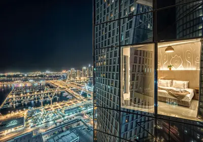 a view of a city at night from a building at Pristine 2BR Apt in Dubai! JBR, Marina & Sea View in Dubai